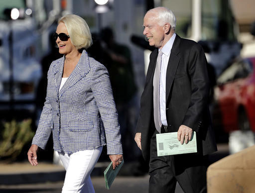 U.S. Sen. John McCain, R-Ariz., and his wife, Cindy McCain, arrive to vote at a polling station, Tuesday, Aug. 30, 2016, in Phoenix. McCain is seeking the republican nomination in Arizona's primar ...
