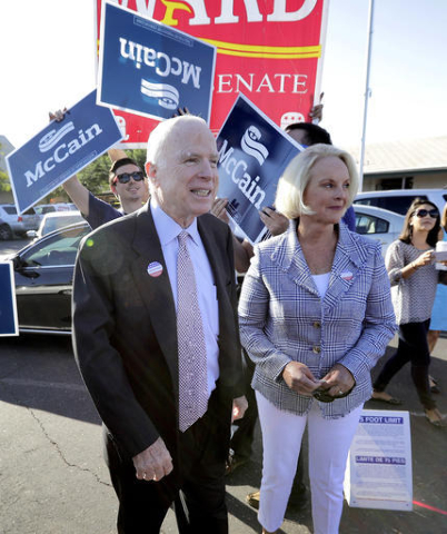 U.S. Sen. John McCain, R-Ariz., and his wife, Cindy McCain, leave a polling station after voting, Tuesday, Aug. 30, 2016, in Phoenix. McCain is seeking the Republican nomination in Arizona's prima ...