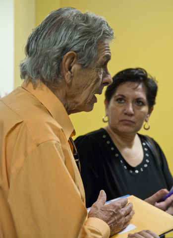Miguel Velazquez speaks with other homeowners affected by Summerlin Energy's bankruptcy after a meeting of the Nevada State Contractors Board at their offices in Henderson on Thursday, Aug. 4, 201 ...