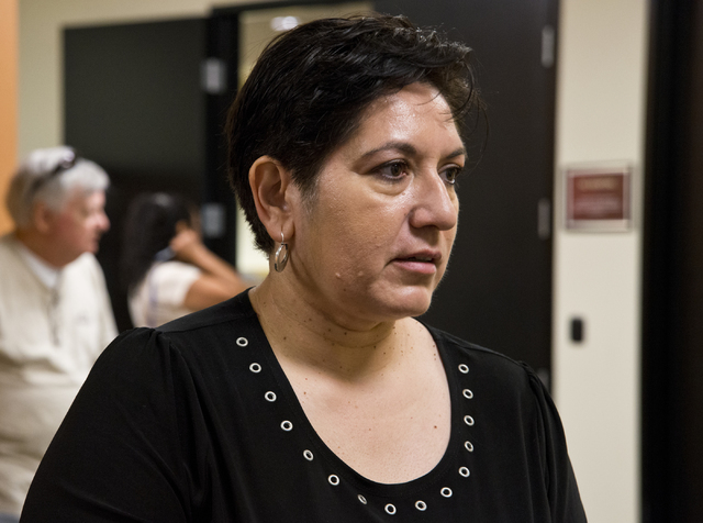 Maria Escamilla speaks with other homeowners affected by Summerlin Energy's bankruptcy after a meeting of the Nevada State Contractors Board at their offices in Henderson on Thursday, Aug. 4, 2016 ...