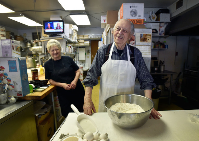 Ernie Feld, right, and his wife, Marika, smile as he prepares dough for a batch of challahs Wednesday, June 8, 2016, in Incline Village, Nev. The 91-year-old Feld continues to bake at his pastry s ...