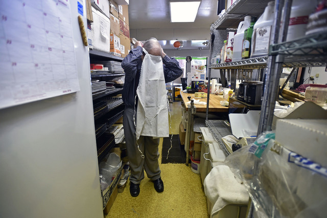 Ernie Feld slips on his apron for another day of baking at his pastry shop Wednesday, June 8, 2016, in Incline Village, Nev. The 91-year-old Feld continues to bake at his pastry shop near the shor ...