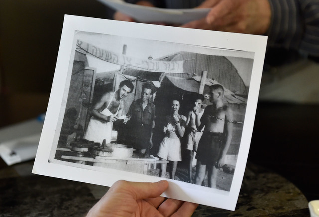 A 1948 photograph, showing a young Ernie Feld,left, serving up ice cream, is displayed at Ernie's International Pastries Wednesday, June 8, 2016, in Incline Village, Nev. The 91-year-old Feld cont ...