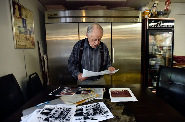 Ernie Feld looks over photographs at his pastry shop Wednesday, June 8, 2016, in Incline Village, Nev. The 91-year-old Feld continues to make his popular poppy-seed strudels at his bakery near the ...