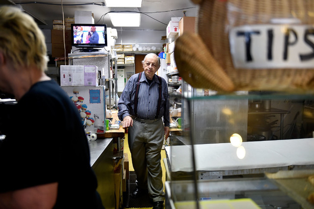 Ernie Feld, right, makes his way up front to meet his wife, Marika, inside his pastry shop Wednesday, June 8, 2016, in Incline Village, Nev. The 91-year-old Feld continues to bake at his pastry sh ...