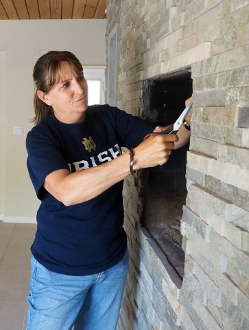 Retired Las Vegas police officer Laurie Bisch works on rehabbing a house in Las Vegas on Friday, Aug. 5, 2016. Jerry Henkel/Las Vegas Review-Journal.