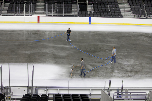 Ice installers lay the first layer of white ice onto the NHL rink at the T-Mobile Arena in Las Vegas on Saturday, June 30, 2016. Loren Townsley/Las Vegas Review-Journal Follow @lorentownsley