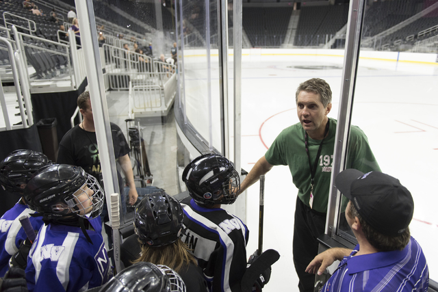 Former NHL player Murray Craven, second from right,  greets members of the Storm Youth Hockey organization as they wait to skate on the newly installed ice at T-Mobile Arena in Las Vegas Wednesday ...