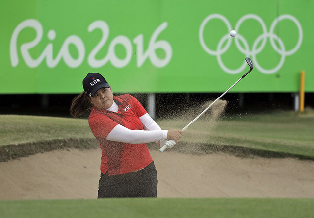Inbee Park of South Korea hits from the bunker on the 18th hole during the final round of the women's golf event at the 2016 Summer Olympics in Rio de Janeiro, Brazil, Saturday, Aug. 20, 2016. Par ...