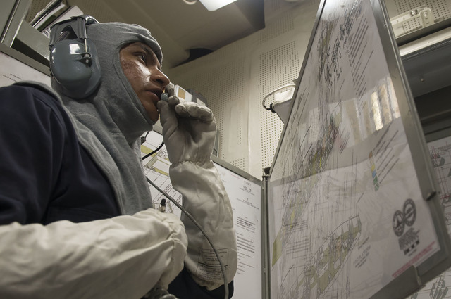 Petty Officer 1st Class Jaquez Francisco of Las Vegas, uses a plotting diagram during a general quarters training exercise aboard USS Porter (DDG 78) July 1, 2016. U.S. Navy Photo by Mass Communic ...