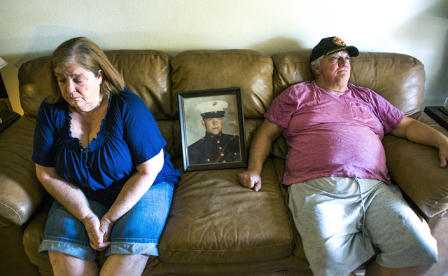 Linda Furrow, left, and her husband Marine veteran Stanley Furrow, sit in the family's home in Las Vegas, Thursday, Aug. 11, 2016. The photo is of Stanley Furrow while he was stationed at Marine C ...