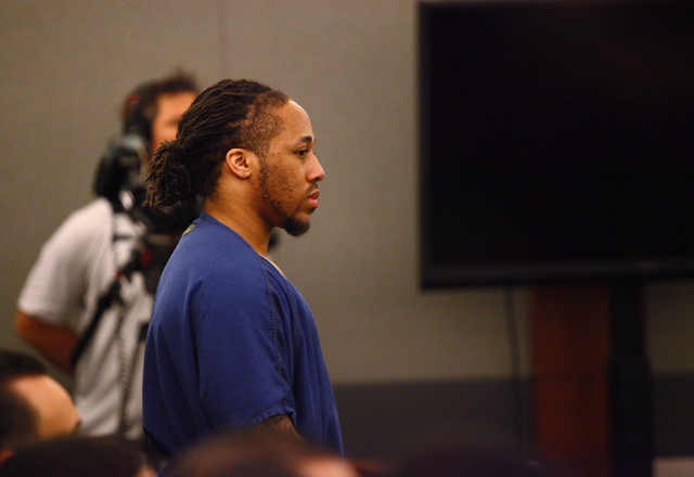 Michael Solid, charged in the slaying of 15-year-old Marcos Vicente Arenas, listens as attorneys argue over whether to allow filming by MY Entertainment's “Las Vegas Law” television show durin ...