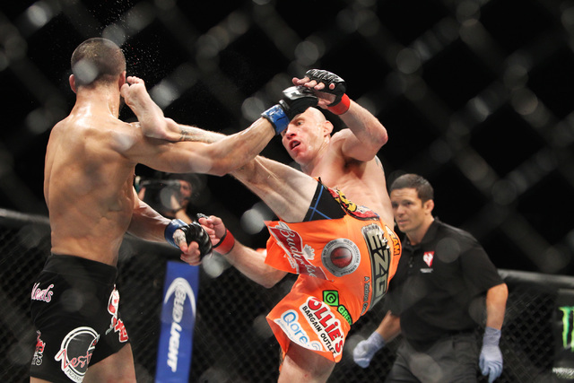 Donald Cerrone connects with a kick to the head of John Makdessi and breaks his jaw during their fight at UFC 187 Saturday, May 23, 2015, at the MGM Grand Garden Arena. Cerrone won by TKO in the s ...