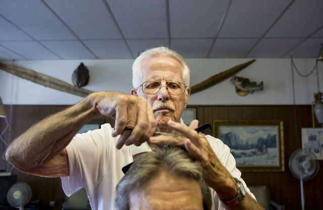 Barber Jon Holten cuts a client's hair at New Image Barber & Styling Wednesday, Aug.17, 2016, in Las Vegas. (Elizabeth Page Brumley/Las Vegas Review-Journal) Follow @ELIPAGEPHOTO