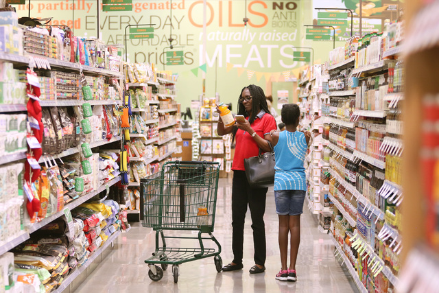 Chimezie Okwuosa, left, shops with her daughter Crystal on the opening day of Natural Grocers at 6305 Simmons St. in North Las Vegas on Tuesday, Aug. 9, 2016. The Colorado-based grocery chain also ...