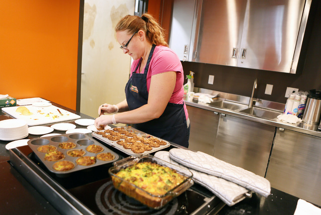 Kerri Oddo plates muffin samples for customers on the opening day of Natural Grocers at 6305 Simmons St. in North Las Vegas on Tuesday, Aug. 9, 2016. The Colorado-based grocery chain also opened a ...