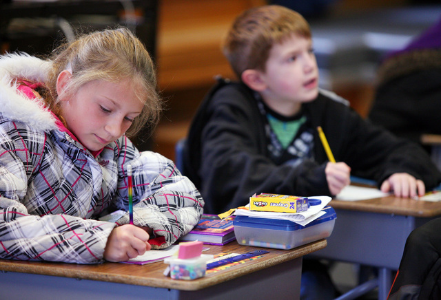 Jamey Harman (CQ), left, and Daniel DeMeglio work in class at Goodsprings Elementary School Monday, Oct. 28, 2013, in Goodsprings, Nev. The historic two-room elementary school was first used in 19 ...