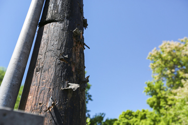 Shrapnel from the Wednesday night bombing that killed one person is stuck in a telephone pole in Panaca, Nev., on Friday, July 15, 2016. (Brett Le Blanc/Las Vegas Review-Journal Follow @bleblancphoto)
