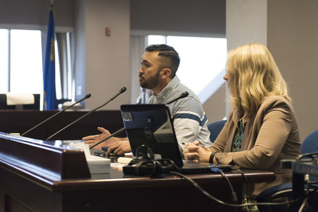 A.J. Buhay, community organizer with the Progressive Leadership Alliance of Nevada, left, speaks during a public meeting on payday loans, Wednesday, Aug. 10, 2016. Tennille Pereira with Legal Aid  ...