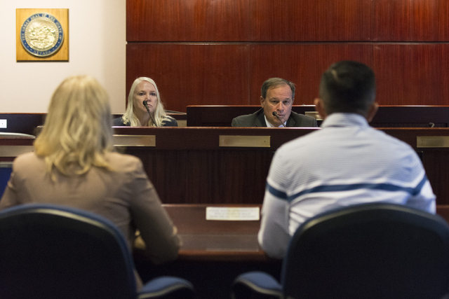 Nevada Treasurer Dan Schwartz, right, and Nevada Deputy Treasurer Sheila Salehian listen as A.J. Buhay, with Progressive Leadership Alliance of Nevada, and Tennille Pereira, with Legal Aid Center  ...