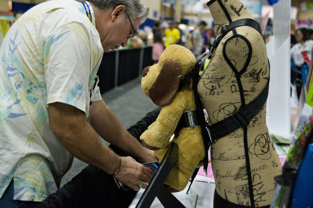 Dennis Presley stops to get information about a dog harness during the SuperZoo Trade Show at the Mandalay Bay Convention Center on the Las Vegas Strip on Tuesday, Aug. 2, 2016. (Daniel Clark/Las ...