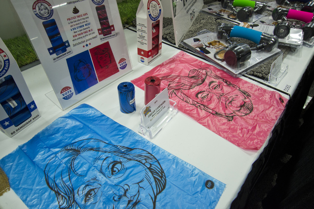 Pet waste bags featuring caricatured versions of presidential hopefuls sit on display during the SuperZoo Trade Show at the Mandalay Bay Convention Center on the Las Vegas Strip on Tuesday, Aug. 2 ...