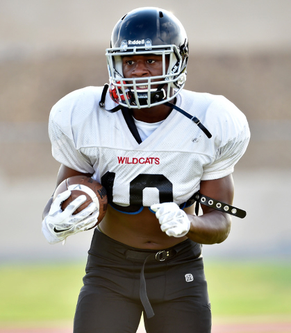 Las Vegas High's Elijah Hicks warms up with the ball before a scrimmage against Green Valley at Green Valley High School Friday, Aug. 19, 2016, in Henderson. David Becker/Las Vegas Review-Journal ...