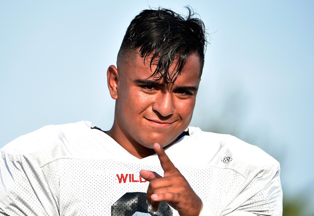 Las Vegas High linebacker Cruz Littlefield mugs for the camera before a scrimmage against Green Valley at Green Valley High School Friday, Aug. 19, 2016, in Henderson. David Becker/Las Vegas Revie ...