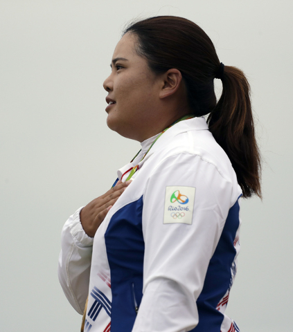 Inbee Park of South Korea, listens to her national anthem after winning the gold medal in the final round of the women's golf event at the 2016 Summer Olympics in Rio de Janeiro, Brazil, Saturday, ...