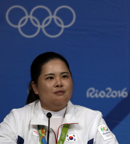Gold medalist Inbee Park of South Korea, speaks at a news conference after the final round of the women's golf event at the 2016 Summer Olympics in Rio de Janeiro, Brazil, Saturday, Aug. 20, 2016. ...