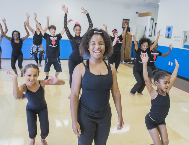 Chancey Wilson, 17, center, joins other participants at a weekday session of R.A.G.E. (Reaching Above Greater Expectations), a summer dance program founded by her brother, former Cirque du Soleil ...