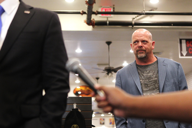 Rick Harrison, co-owner of World Famous Gold & Silver Pawn Shop, listens to then-Republican presidential candidate U.S. Sen. Marco Rubio, R-Fla., during a press conference at the shop in Las V ...
