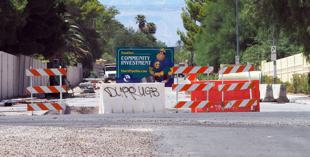 Sewer line construction takes place at Oquendo Road and Annie Oakley Drive in Las Vegas, Thursday, Aug. 11, 2016. Elena and Alexander Wilding say that the construction has damaged the foundation o ...