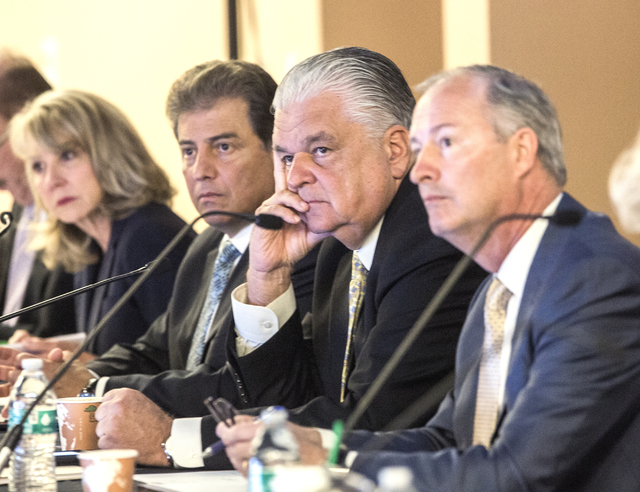 Southern Nevada Tourism Infrastructure Committee members Kristin McMillan, left, George Markantonis, Steve Sisolak and Steve Hill, listen during public comment on the proposed stadium Thursday, Au ...