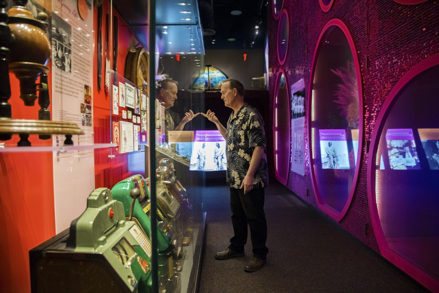 Museum director Dennis McBride looks through casino programs, letterheads and showbills from the 1950s preserved at the Nevada State Museum, Las Vegas. (Benjamin Hager/Las Vegas Review-Journal)