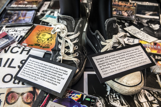 CDs, flyers and album art from the 1990s and early 2000s recall the venerable Huntridge Theatre's life as a concert venue in an exhibit at the Nevada State Museum, Las Vegas. (Benjamin Hager/Las V ...