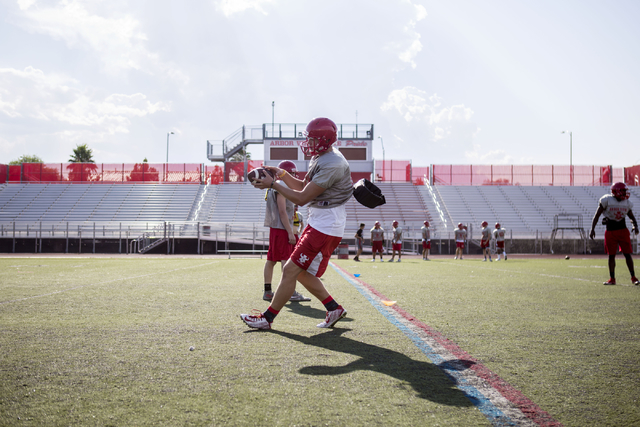 Arbor View High School quarterback Hayden Bollinger catches the ball during football practice at the school Tuesday, Aug. 23, 2016, in Las Vegas. Elizabeth Page Brumley/Las Vegas Review-Journal Fo ...
