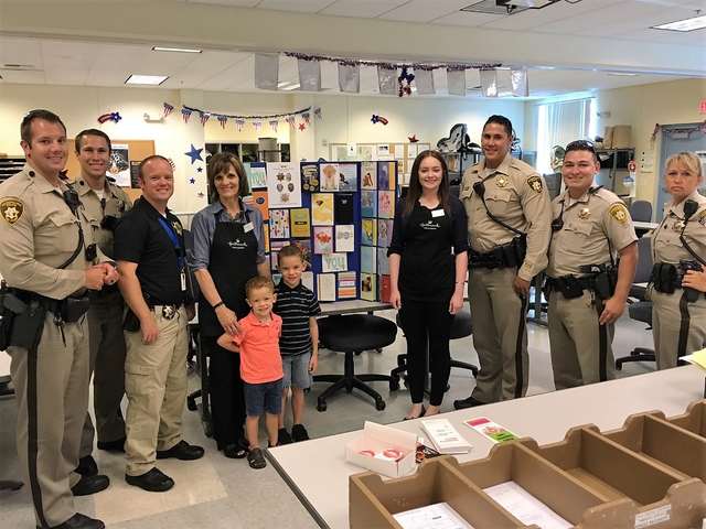 Officers and Hallmark employees and family show off cards during the store's Thank Our Blue program event at 1445 W. Sunset Road, which collected more than 700 cards in early August 2016. Special ...