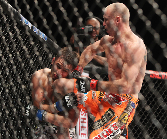 Donald Cerrone lands a combination to the body and head of Myles Jury during their fight at UFC 182 Saturday, Jan. 3, 2015 at the MGM Grand Garden Arena.Cerrone won a unanimous decision. (Sam Morr ...
