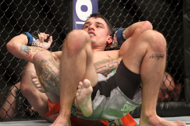 Donald Cerrone controls Myles Jury, top, during their fight at UFC 182 Saturday, Jan. 3, 2015 at the MGM Grand Garden Arena.Cerrone won a unanimous decision. (Sam Morris/Las Vegas Review-Journal)