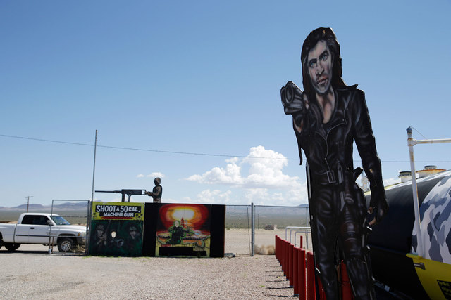 Painted signs are seen outside of the Last Stop outdoor shooting range Wednesday, Aug. 27, 2014, in White Hills, Ariz. Instructor Charles Vacca was accidentally killed Monday, Aug. 25, 2014, at th ...