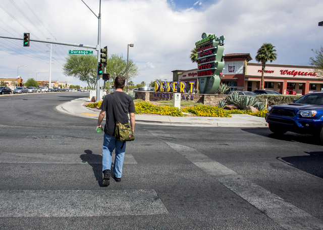 A man crosses Durango Drive and Warm Springs Road near the Desert Marketplace on Thursday, Aug. 18, 2016. Jeff Scheid/Las Vegas Review-Journal Follow @jeffscheid