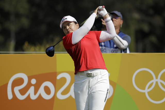 Inbee Park of South Korea, watches her tee shot on the 3rd hole during the first round of the women's golf event at the 2016 Summer Olympics in Rio de Janeiro, Brazil, Wednesday, Aug. 17, 2016. (C ...