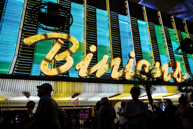 People pass the exterior of Binion's hotel-casino at Fremont Street Experience in downtown Las Vegas on Wednesday, Aug. 10, 2016. (Chase Stevens/Las Vegas Review-Journal)