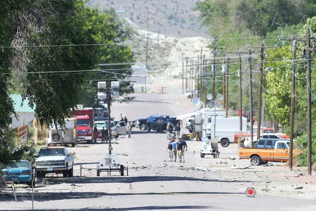 Police investigate shrapnel from a bombing that killed one person on Fifth Street in Panaca, Nev., on Thursday, July 14, 2016. (Brett Le Blanc/Las Vegas Review-Journal) Follow @bleblancphoto