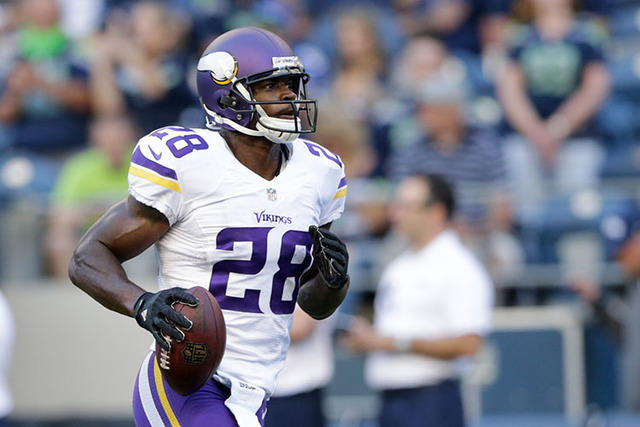 Minnesota Vikings running back Adrian Peterson (28) takes part in warmups before a preseason NFL football game against the Seattle Seahawks, Thursday, Aug. 18, 2016, in Seattle. (John Froschauer/AP)