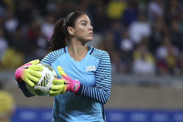 In this Aug. 3, 2016, file photo, U.S. goalkeeper Hope Solo takes the ball during a women's Olympic football tournament match against New Zealand in Belo Horizonte, Brazil.  (AP Photo/Eugenio Savi ...