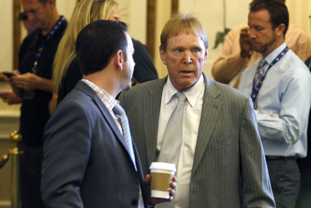 Oakland Raiders owner Mark Davis, right, makes his way into the NFL owners meeting in Charlotte N.C., on Tuesday, May 24, 2016. (Bob Leverone/AP)