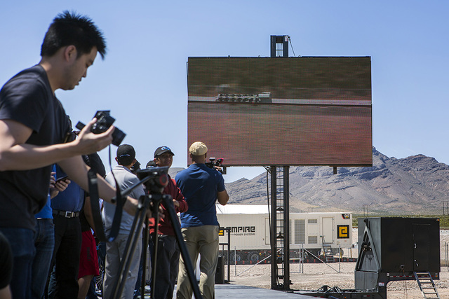 Media and invited guest view a video replay of the Hyperloop One test vehicle propelling down a set of tracks during its first public test at Apex on Wednesday, May 11, 2016.  (Jeff Scheid/Las Veg ...