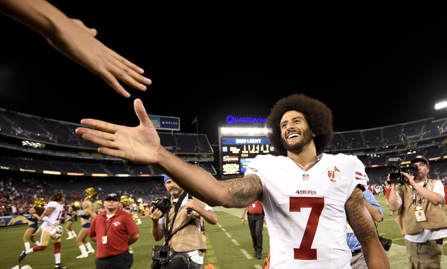 San Francisco 49ers quarterback Colin Kaepernick shakes hands with fans after the 49ers defeated the San Diego Chargers 31-21 during an NFL preseason football game Thursday, Sept. 1, 2016, in San  ...